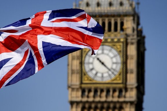 A British flag floats in front of the "Big Ben" clock Tower on July 23, 2012 in London, four days before the start of the London 2012 Olympic Games. Seven years in the making, costing £9.3 billion ($14.5 billion) and featuring 10,490 athletes, the London Olympics opens on July 27 with 302 gold medals to be won and hard-fought reputations at stake. AFP PHOTO / FABRICE COFFRINI